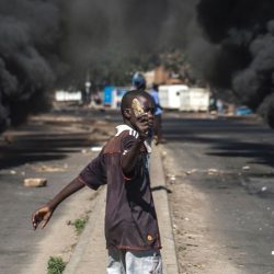 On Thursday a Zimbabwean protester is photographed in the country's second city, Bulawayo, as some people clashed with police after two activists were detained. Source: AFP 7 July 2016