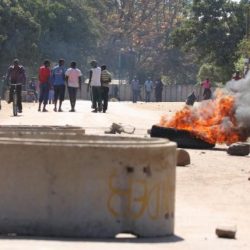 A tyre burns on a street in Mufakose in Harare, Zimbabwe, July 6, 2016. REUTERS/Philimon Bulawayo